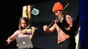 Svampolin creator Laurel S Purdue performs with the Svampolin on stage with BSMT student Ally Stout, who uses a normal violin.