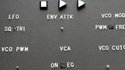 A board with different arrows and settings for VCA and audio adjustments to play a synthesizer.